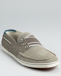 Tretorn's sporty take on the classic boat shoe adds a lower profile and a striped elastic band across the tongue. Tretorn's sporty take on the classic boat shoe adds a lower profile and a striped elastic band across the tongue.