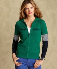 Sporty meets chic in Tommy Hilfiger's knit hoodie, complete with a luxe embroidered logo at the chest. Sporty meets chic in Tommy Hilfiger's knit hoodie, complete with a luxe embroidered logo at the chest.