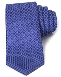 Rich color and a cool, optical pattern define this luxurious silk tie cut in a classic width from the iconic designer Valentino. Rich color and a cool, optical pattern define this luxurious silk tie cut in a classic width from the iconic designer Valentino.