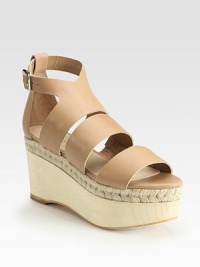 Adjustable, smooth leather straps accompanied by a wooden, espadrille-inspired wedge and platform. Wooden wedge, 3 (75mm)Wooden platform, 2 (50mm)Compares to a 1 heel (25mm)Leather upperLeather liningBuffed leather solePadded insoleImportedOUR FIT MODEL RECOMMENDS ordering true size. Adjustable, smooth leather straps accompanied by a wooden, espadrille-inspired wedge and platform. Wooden wedge, 3 (75mm)Wooden platform, 2 (50mm)Compares to a 1 heel (25mm)Leather upperLeather liningBuffed leather solePadded insoleImportedOUR FIT MODEL RECOMMENDS ordering true size.