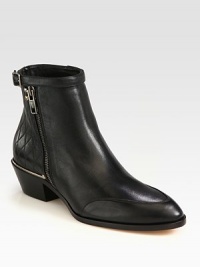 Quilted leather silhouette with exposed zippers, polished metal accents and an adjustable strap hitting just above the ankle. Stacked heel, 1¼ (30mm)Leather upperSide zipperLeather lining and soleMade in ItalyOUR FIT MODEL RECOMMENDS ordering ½ size down as this style runs large. Quilted leather silhouette with exposed zippers, polished metal accents and an adjustable strap hitting just above the ankle. Stacked heel, 1¼ (30mm)Leather upperSide zipperLeather lining and soleMade in ItalyOUR FIT MODEL RECOMMENDS ordering ½ size down as this style runs large.