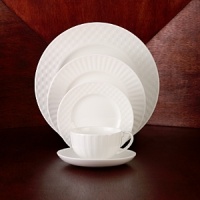 Simple shapes of crisp white are accented with precisely etched lines. Contrasting black matte jasper accessories with glazed interiors are also available. Bone china. Simple shapes of crisp white are accented with precisely etched lines. Contrasting black matte jasper accessories with glazed interiors are also available. Bone china.
