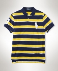 A trim-fitting tennis polo is crafted from breathable cotton mesh in a sleek striped pattern with signature embroidery for athletic appeal. A trim-fitting tennis polo is crafted from breathable cotton mesh in a sleek striped pattern with signature embroidery for athletic appeal.