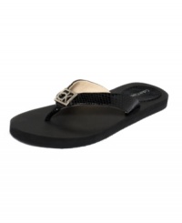 A shiny silver brand emblem accents the toe of Calvin Klein's Sammy thongs, making these sandals anything but basic. A shiny silver brand emblem accents the toe of Calvin Klein's Sammy thongs, making these sandals anything but basic.