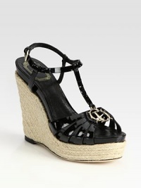 Adjustable patent leather t-strap tops a classic espadrille wedge and platform. Hemp-covered wedge, 5½ (140mm)Covered platform, 1 (25mm)Compares to a 4½ heel (115mm)Patent leather upperLeather liningBuffed leather solePadded insoleMade in Italy Adjustable patent leather t-strap tops a classic espadrille wedge and platform. Hemp-covered wedge, 5½ (140mm)Covered platform, 1 (25mm)Compares to a 4½ heel (115mm)Patent leather upperLeather liningBuffed leather solePadded insoleMade in Italy