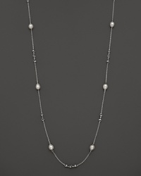 This sterling silver necklace, gleaming with freshwater pearls, makes an elegant statement. By Di MODOLO.