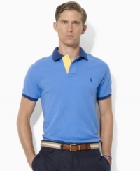 Bold color-blocking enlivens a classic polo crafted from lightweight cotton mesh for the perfect blend of comfort and eye-catching style. Bold color-blocking enlivens a classic polo crafted from lightweight cotton mesh for the perfect blend of comfort and eye-catching style.