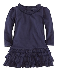 A comfortable drop-waist dress in soft cotton jersey is finished with a ruffled neckline and skirt for a girly look. A comfortable drop-waist dress in soft cotton jersey is finished with a ruffled neckline and skirt for a girly look.