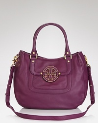 Tory Burch's hobo enlivens classic leather her signature stamp and a must-have hue. From workday to weekend, this versatile bag will make closet staples pop. Tory Burch's hobo enlivens classic leather her signature stamp and a must-have hue. From workday to weekend, this versatile bag will make closet staples pop.