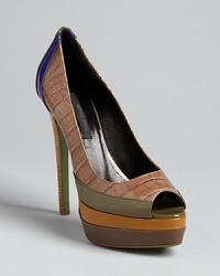 Ruthie Davis® takes the colorblocking trend into her own unique style, in peep toe platform pumps that will stand their ground for many seasons. Ruthie Davis® takes the colorblocking trend into her own unique style, in peep toe platform pumps that will stand their ground for many seasons.