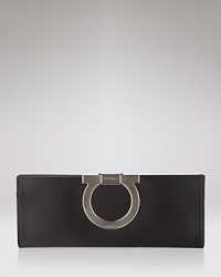 A sleek satin clutch with signature logo clip closure from Salvatore Ferragamo. A sleek satin clutch with signature logo clip closure from Salvatore Ferragamo.