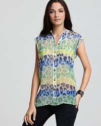 Animal print and color blocking combine on this Equipment blouse in a juxtaposition of two trends that make for one wild style. Animal print and color blocking combine on this Equipment blouse in a juxtaposition of two trends that make for one wild style.