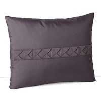 A lush, contrasting grosgrain ribbon, folded into textural squares, adds detail to this silk decorative pillow. A lush, contrasting grosgrain ribbon, folded into textural squares, adds detail to this silk decorative pillow.