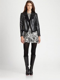 Softer than imaginable, a leather moto jacket with an enviable fit, thanks to stretch-fabric insets.Notched collarZipper detail on sleevesAsymmetrical front zipperZipper pocketsFully linedAbout 21 from shoulder to hemBody: lambskin leatherInsets: wool/nylon/elastaneDry clean by leather specialistImported Model shown is 5'10 (177cm) wearing US size Small. Softer than imaginable, a leather moto jacket with an enviable fit, thanks to stretch-fabric insets.Notched collarZipper detail on sleevesAsymmetrical front zipperZipper pocketsFully linedAbout 21 from shoulder to hemBody: lambskin leatherInsets: wool/nylon/elastaneDry clean by leather specialistImported Model shown is 5'10 (177cm) wearing US size Small.