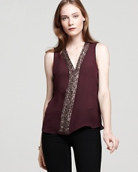 Glimmering beads, a draped back and luxe silk-these are the gorgeous elements that compose this embellished Parker tank. The perfect piece to elevate staple black pants, slip it on for date night and exude endless allure. Glimmering beads, a draped back and luxe silk-these are the gorgeous elements that compose this embellished Parker tank. The perfect piece to elevate staple black pants, slip it on for date night and exude endless allure.