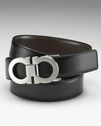 Salvatore Ferragamo classic Double Gancini reversible belt. Quintessentially classic and luxurious reversible leather belt with topstitching detailing and double-brushed buckle. Ferragamo is engraved on the buckle. Salvatore Ferragamo classic Double Gancini reversible belt. Quintessentially classic and luxurious reversible leather belt with topstitching detailing and double-brushed buckle. Ferragamo is engraved on the buckle.