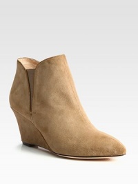 A stable wedge heightens this casual-cool suede ankle boot, with patent leather trim and side elastic gores. Self-covered wedge, 3 (75mm)Suede upper with patent leather trim and elastic goresLeather lining and solePadded insoleImportedOUR FIT MODEL RECOMMENDS ordering one half size up as this style runs small. A stable wedge heightens this casual-cool suede ankle boot, with patent leather trim and side elastic gores. Self-covered wedge, 3 (75mm)Suede upper with patent leather trim and elastic goresLeather lining and solePadded insoleImportedOUR FIT MODEL RECOMMENDS ordering one half size up as this style runs small.