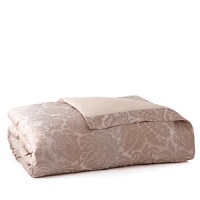 Egyptian cotton is woven in Italy into a serene and sweet sateen jacquard. Large scrolls play across the shining surface of the duvet covers and shams, each finished with a plain hem and decorated with a subtle flange. The duvet covers are backed in a plain sateen while the shams feature the jacquard pattern on the front and back. Egyptian cotton is woven in Italy into a serene and sweet sateen jacquard. Large scrolls play across the shining surface of the duvet covers and shams, each finished with a plain hem and decorated with a subtle flange. The duvet covers are backed in a plain sateen while the shams feature the jacquard pattern on the front and back.