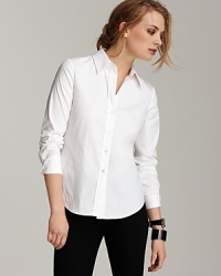 Classic and slim-fitting, Theory's Larissa stretch cotton shirt can be worn with anything from a blazer and skirt to your favorite jeans. Classic and slim-fitting, Theory's Larissa stretch cotton shirt can be worn with anything from a blazer and skirt to your favorite jeans.