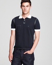 This Is Not A Polo Shirt By Band of Outsiders pushes the envelope with this deft and ironic design, featuring inside out details like exposed seams and a stitched pocket for a unique take on contemporary fashion. This Is Not A Polo Shirt By Band of Outsiders pushes the envelope with this deft and ironic design, featuring inside out details like exposed seams and a stitched pocket for a unique take on contemporary fashion.