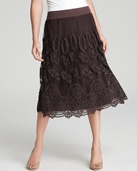 Intricate crochet florals bloom against a russet XCVI skirt for a fresh fashion statement. Play up the understated aesthetic with nude accents. Intricate crochet florals bloom against a russet XCVI skirt for a fresh fashion statement. Play up the understated aesthetic with nude accents.