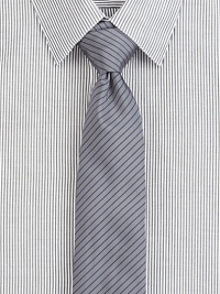 A power style for the power player, crafted in a luxurious silk blend, enhanced with a contrasting thin stripe pattern.About 2½ wide62% silk/38% cottonDry cleanMade in USA of Italian fabric