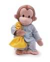 Dressed in soft, striped pajamas this soft, huggable plush Curious George doll is holding his favorite yellow blanket.