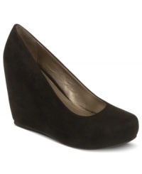 Your head may be in the clouds--literally--when you wear these towering wedges. Fergalicious' Dreamer platform pumps feature a smooth closed round toe and are covered in cool supple fabrics. Your head may be in the clouds--literally--when you wear these towering wedges. Fergalicious' Dreamer platform pumps feature a smooth closed round toe and are covered in cool supple fabrics.