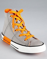 Criss cross topstitching and clever contrast accents update Converse' classic high top sneaker for the 21st century. Criss cross topstitching and clever contrast accents update Converse' classic high top sneaker for the 21st century.