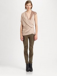 This modern marvel has a contrasting leather cap sleeve, single short dolman sleeve and an asymmetrical back hem. Crossover v-neckSingle leather cap sleeveSingle short dolman sleeveAsymmetrical back hemViscoseDry cleanImported of Italian fabricModel shown is 5'10 (177cm) wearing US size Small. This modern marvel has a contrasting leather cap sleeve, single short dolman sleeve and an asymmetrical back hem. Crossover v-neckSingle leather cap sleeveSingle short dolman sleeveAsymmetrical back hemViscoseDry cleanImported of Italian fabricModel shown is 5'10 (177cm) wearing US size Small.