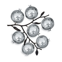 Michael Aram pomegranate seder plate. The centerpiece of Passover is the Seder plate. On the Seder plate there are seven different Passover foods, each symbolizing a unique element of the Exodus story. Here in stainless steel with oxidized bronze stems. Michael Aram pomegranate seder plate. The centerpiece of Passover is the Seder plate. On the Seder plate there are seven different Passover foods, each symbolizing a unique element of the Exodus story. Here in stainless steel with oxidized bronze stems.
