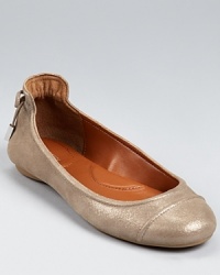 Dramatic detailing and a metallic finish elevate the classic ballet flat to stylish new heights. By Calvin Klein. Dramatic detailing and a metallic finish elevate the classic ballet flat to stylish new heights. By Calvin Klein.