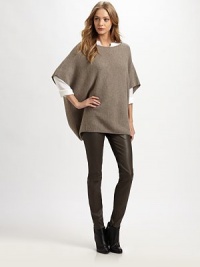Wool and cashmere boatneck infused with traditional poncho sleeves and a length that hits below the hips. BoatneckPoncho sleevesLonger length hits below the hips70% wool/30% cashmereDry cleanImportedModel shown is 5'10 (177cm) wearing US size Small. Wool and cashmere boatneck infused with traditional poncho sleeves and a length that hits below the hips. BoatneckPoncho sleevesLonger length hits below the hips70% wool/30% cashmereDry cleanImportedModel shown is 5'10 (177cm) wearing US size Small.