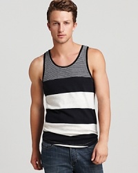 An exciting graphic stripe pattern defines this soft cotton tank from ALTERNATIVE, perfect for trips to the shore or hanging out back on warm weather evenings. An exciting graphic stripe pattern defines this soft cotton tank from ALTERNATIVE, perfect for trips to the shore or hanging out back on warm weather evenings.