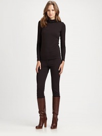 Offering classically sleek style, a jersey turtleneck with a unique curved yoke.TurtleneckLong sleevesCurved yokeEmbroidered logo at napePull-on styleAbout 24 from shoulder to hemViscose/elastaneHand washImported Model shown is 5'11 (180cm) wearing US size Small.This style runs true to size. We recommend ordering your usual size for a standard fit. Offering classically sleek style, a jersey turtleneck with a unique curved yoke.TurtleneckLong sleevesCurved yokeEmbroidered logo at napePull-on styleAbout 24 from shoulder to hemViscose/elastaneHand washImported Model shown is 5'11 (180cm) wearing US size Small.This style runs true to size. We recommend ordering your usual size for a standard fit.