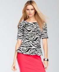 Make your next ensemble pop with INC's vibrant petite top, adorned with a bold zebra print and a peplum hem. Make your next ensemble pop with INC's vibrant petite top, adorned with a bold zebra print and a peplum hem.