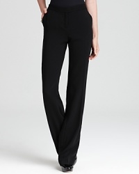 Strike at a distance in impeccably tailored Anne Klein pants, featuring a floor-skimming silhouette accentuated by satin tuxedo stripes for serious fashion presence. Strike at a distance in impeccably tailored Anne Klein pants, featuring a floor-skimming silhouette accentuated by satin tuxedo stripes for serious fashion presence.