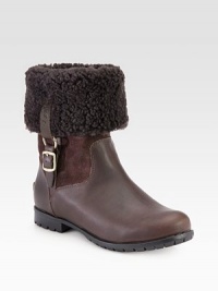 Stay warm wearing this shearling-lined boot made of rich leather and suede with buckled goldtone hardware. Rubber heel, 1 (25mm)Shaft, 11Leg circumference, 13Leather, suede and shearling upperPull-on style with leather adjustable buckle strapShearling liningRubber trek solePadded insoleImported