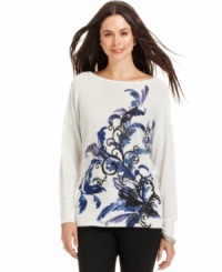 Alfani's petite graphic sweater features a scrolling print and metallic-flecked knit for a bit of sparkle. Alfani's petite graphic sweater features a scrolling print and metallic-flecked knit for a bit of sparkle.