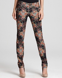 A vibrant botanical print packs a punch on these Alice + Olivia jeans, tailored in a sleek skinny silhouette. A vibrant botanical print packs a punch on these Alice + Olivia jeans, tailored in a sleek skinny silhouette.