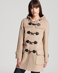 Featuring a timeless plaid silhouette punctuated with rustic toggle closures, this Burberry Brit coat is a chic addition to your cold-weather repertoire. Featuring a timeless plaid silhouette punctuated with rustic toggle closures, this Burberry Brit coat is a chic addition to your cold-weather repertoire.