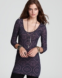 Top off your favorite jeans with this stretchy tunic-style Free People top, enriched with an intriguing masquerade-inspired print. Top off your favorite jeans with this stretchy tunic-style Free People top, enriched with an intriguing masquerade-inspired print.