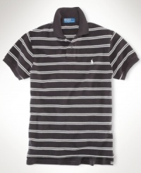 A classic-fitting short-sleeved polo shirt is crafted from breathable cotton mesh with a sleek striped pattern for casual polish. A classic-fitting short-sleeved polo shirt is crafted from breathable cotton mesh with a sleek striped pattern for casual polish.