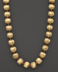 Hand engraved beaded necklace in 18K yellow gold from Marco Bicego's Africa collection. Hand engraved beaded necklace in 18K yellow gold from Marco Bicego's Africa collection.