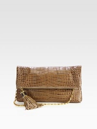 Luxurious crocodile embossed leather in a chic fold-over design accented with oversized tassel detail and radiant hardware.Detachable chain shoulder strap, 10½ dropTop zip closure with magnetic flapOne open pocket under flapOne inside zip pocketTwo inside open pocketsLeather lining13½W X 8H X 1DImported Luxurious crocodile embossed leather in a chic fold-over design accented with oversized tassel detail and radiant hardware.Detachable chain shoulder strap, 10½ dropTop zip closure with magnetic flapOne open pocket under flapOne inside zip pocketTwo inside open pocketsLeather lining13½W X 8H X 1DImported