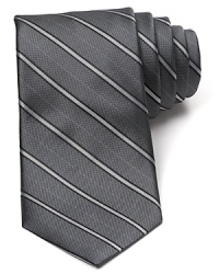 An immaculate silk tie with a classic pinstripe pattern from Michael Kors brings a bit of panache to your office attire. An immaculate silk tie with a classic pinstripe pattern from Michael Kors brings a bit of panache to your office attire.