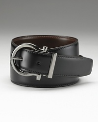 Salvatore Ferragamo Gunmetal Gancini reversible belt. Rich leather. Ferragamo is engraved on the buckle. Salvatore Ferragamo Gunmetal Gancini reversible belt. Rich leather. Ferragamo is engraved on the buckle.
