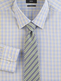 A smart plaid in softened shades on pure cotton.Modified point collarButton frontBarrel cuffsCottonDry cleanImported