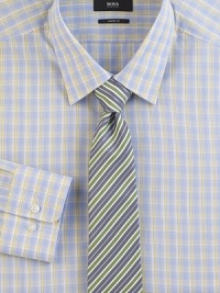 A smart plaid in softened shades on pure cotton.Modified point collarButton frontBarrel cuffsCottonDry cleanImported A smart plaid in softened shades on pure cotton.Modified point collarButton frontBarrel cuffsCottonDry cleanImported