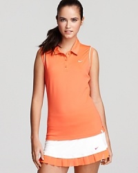 On or off the court you'll be a sure hit in this sleeveless polo tennis tank from Nike featuring Dri-FIT Technology to wick away moisture. On or off the court you'll be a sure hit in this sleeveless polo tennis tank from Nike featuring Dri-FIT Technology to wick away moisture.